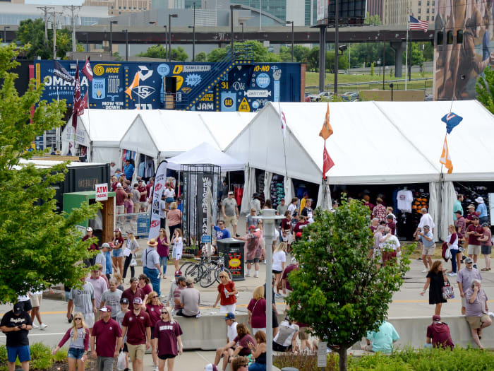 Jun 28, 2021; Omaha, Nebraska, USA; Fans shop the merchandise tents before the game between the Vanderbilt Commodores and the Mississippi St. Bulldogs at TD Ameritrade Park.